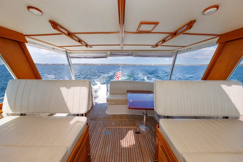 Slide: The Image of Luxurious interior of a 2000 Eastbay 49 yacht with ocean view and elegant seating. - 23