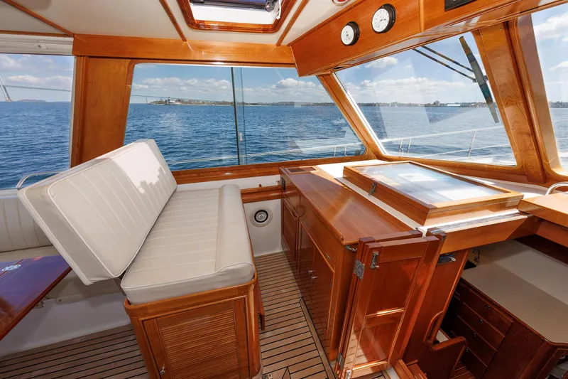 Slide: The Image of Luxurious Eastbay 49 yacht interior with wooden finish and ocean view, 2000 model. - 27