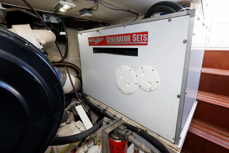 Slide: The Image of Engine room of a 2000 Eastbay 49 featuring a Northern Lights generator set. - 40