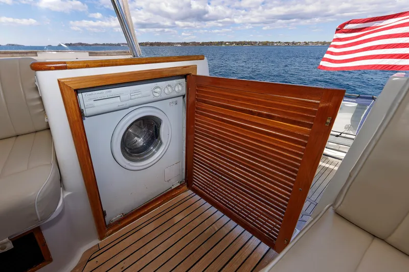 Slide: The Image of Laundry machine on Eastbay 49 yacht, 2000 model, with ocean view and American flag. - 41
