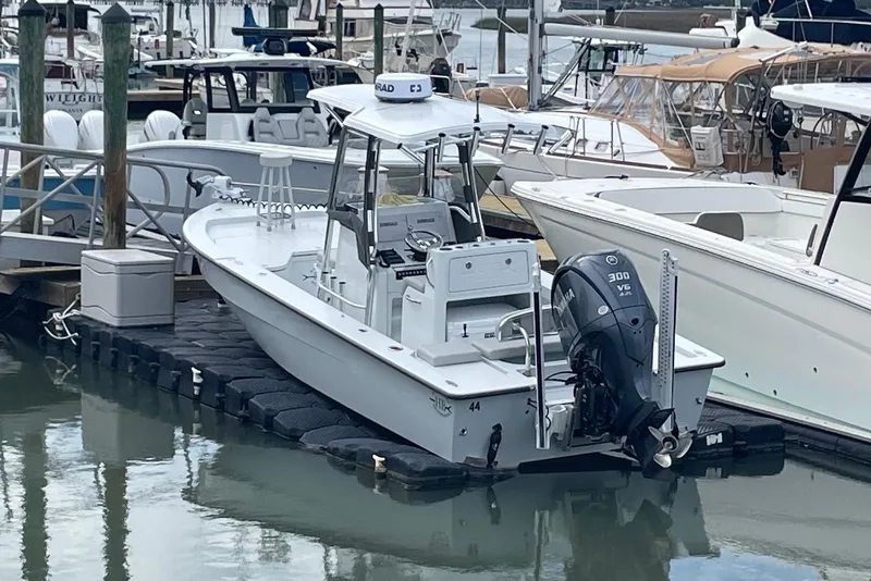 Slide: The Image of 2025 Hell's Bay Estero boat docked with Yamaha 300 V6 engine. - 4