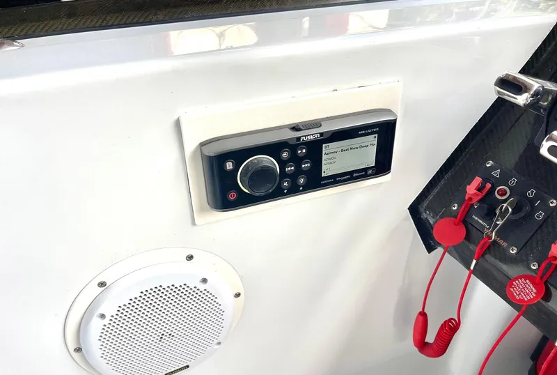 Slide: The Image of Control panel of a 2008 Goetz Custom Boats 33' Limo Tender with audio system and safety features. - 10