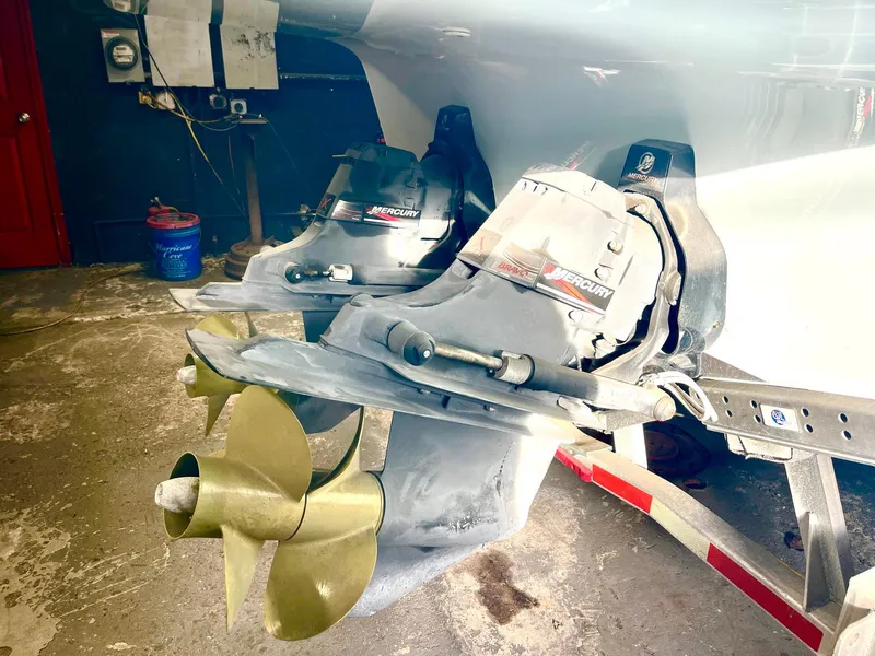 Slide: The Image of Propellers and Mercury engines of a 2008 Goetz Custom Boats 33' Limo Tender in a workshop. - 17