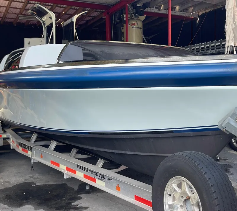 Slide: The Image of 2008 Goetz Custom Boats 33' Limo Tender on trailer in storage facility. - 19