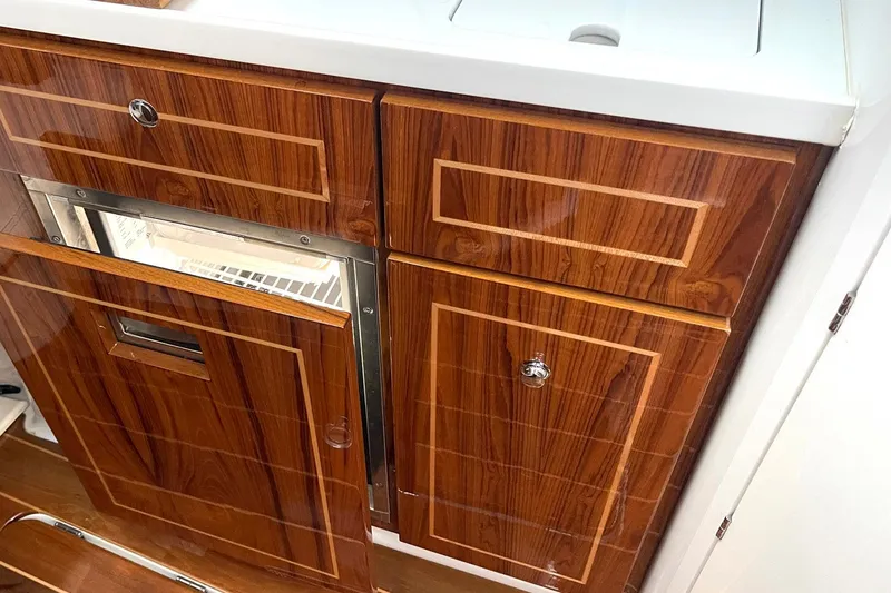 Slide: The Image of Luxurious wood cabinetry in 2024 HCB 48 Campeon boat interior. - 19