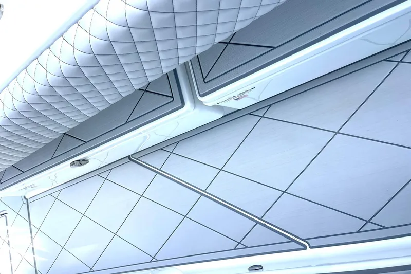 Slide: The Image of 2024 HCB 48 Campeon boat interior with quilted upholstery and sleek design. - 14