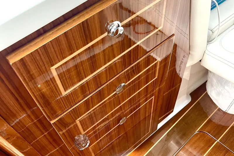 Slide: The Image of Luxurious wooden cabinetry inside 2024 HCB 48 Campeon boat, featuring polished finish and elegant design. - 20
