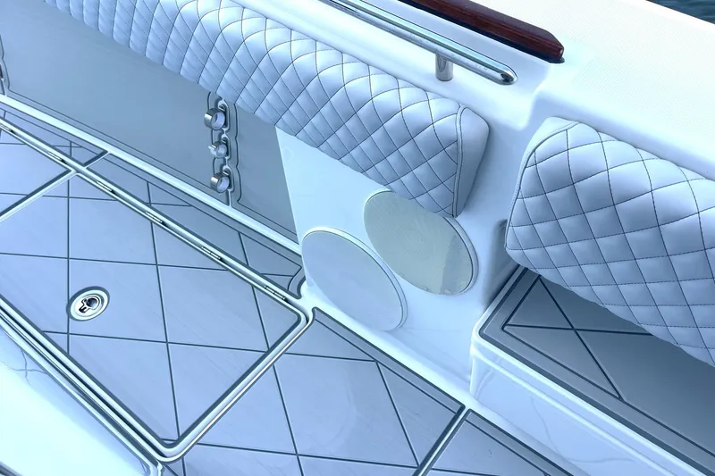 Slide: The Image of 2024 HCB 48 Campeon boat interior with quilted seating and sleek design. - 15