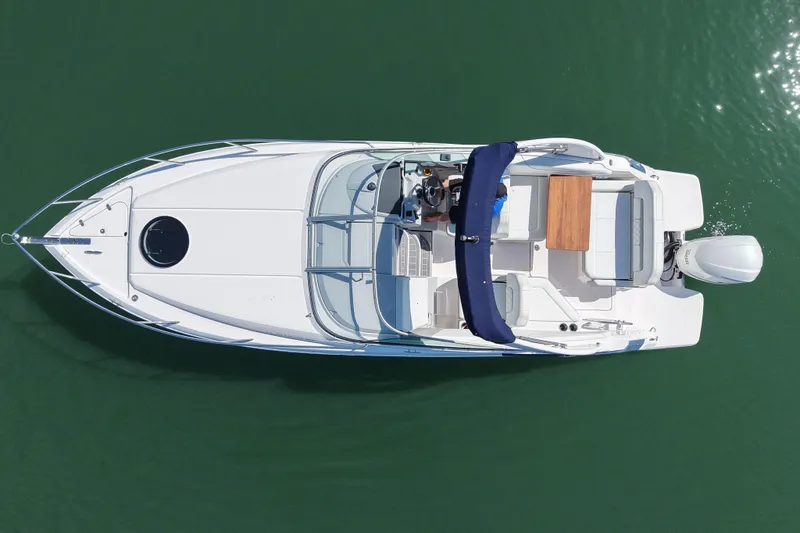 Slide: The Image of Overhead view of 2020 Regal 26 XO boat on calm water. - 11