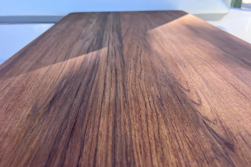 Slide: The Image of Close-up of wood grain texture on a 2020 Regal 26 XO boat surface. - 19