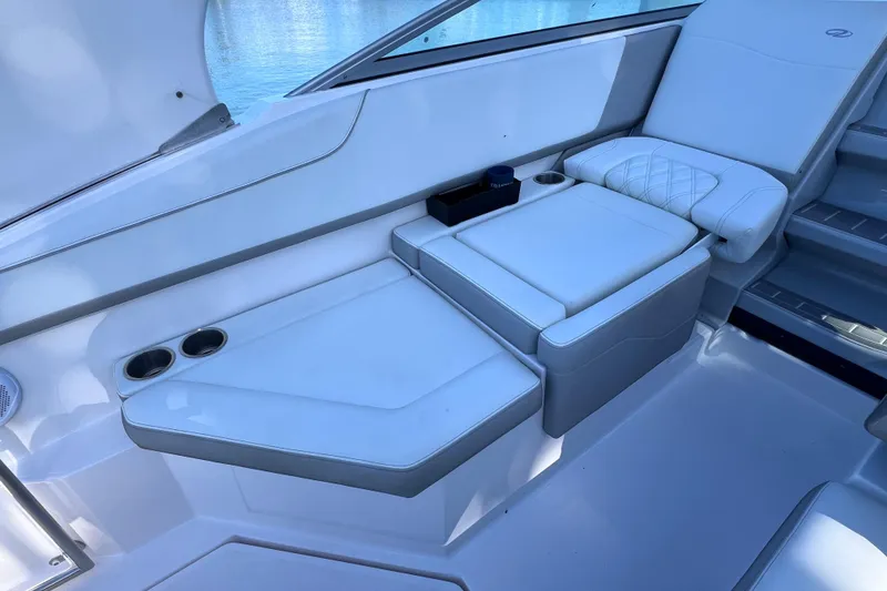 Slide: The Image of Luxurious seating area on a 2020 Regal 26 XO boat with cup holders. - 21