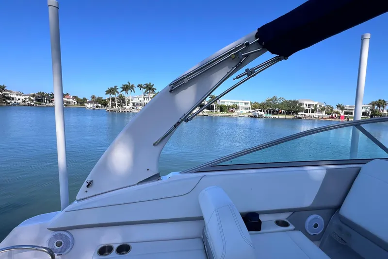 Slide: The Image of 2020 Regal 26 XO boat interior with scenic waterfront view. - 28