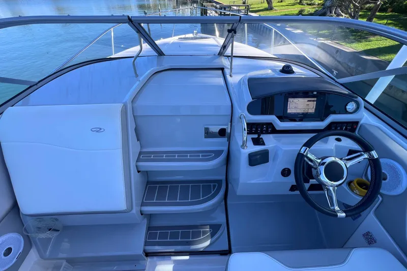 Slide: The Image of 2020 Regal 26 XO boat cockpit with modern steering and navigation system. - 31