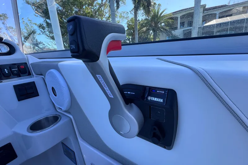 Slide: The Image of 2020 Regal 26 XO boat throttle control with Yamaha branding, interior view. - 35