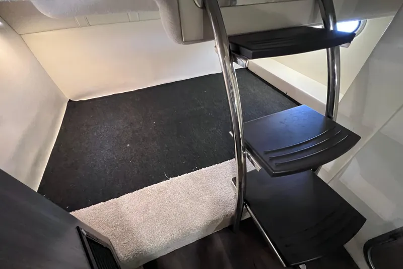 Slide: The Image of Interior cabin of 2020 Regal 26 XO boat with sleek metal stairs. - 53