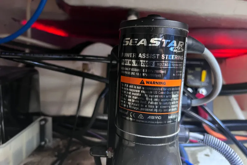 Slide: The Image of SeaStar power assist steering unit in a 2020 Regal 26 XO boat. - 60