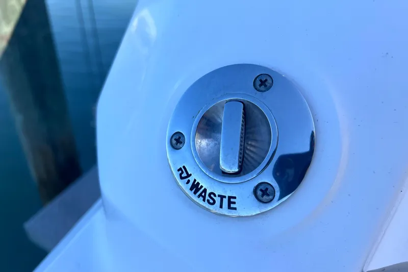 Slide: The Image of Waste cap on 2020 Regal 26 XO boat, chrome finish, dockside view. - 63