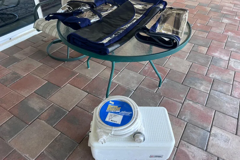 Slide: The Image of Outdoor table with boat cover and marine electrical cord, Regal 26 XO 2020 accessories. - 64