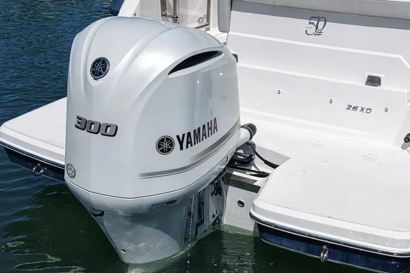 Slide: The Image of Yamaha 300 outboard motor on a 2020 Regal 26 XO boat in water. - 8