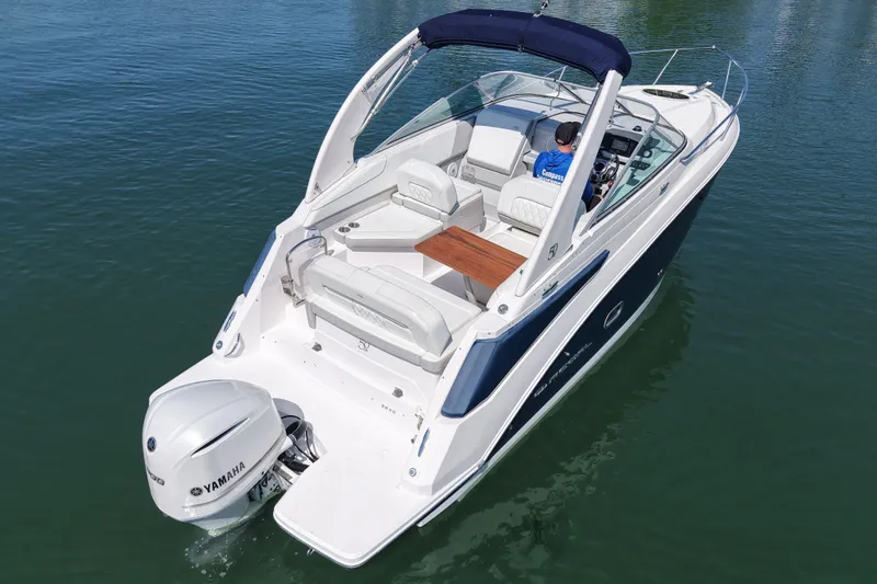 Slide: The Image of 2020 Regal 26 XO boat with Yamaha outboard engine on calm water. - 9