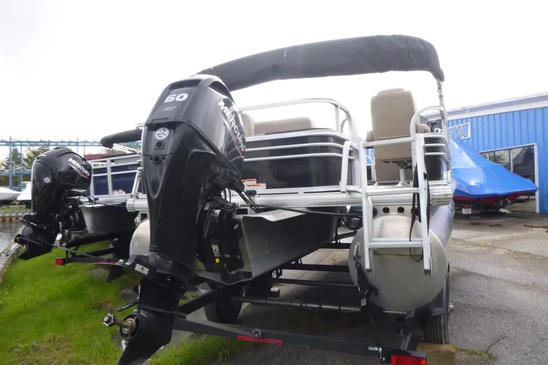 Slide: The Image of 2021 Sun Tracker Fishin' Barge 20 DLX pontoon boat with Mercury outboard motor. - 4