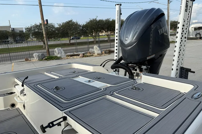 Slide: The Image of 2023 Skeeter SX240 boat with Yamaha engine, featuring sleek deck design and storage compartments. - 10