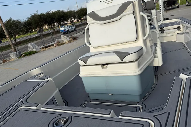 Slide: The Image of 2023 Skeeter SX240 boat interior with cushioned seating and sleek design. - 13