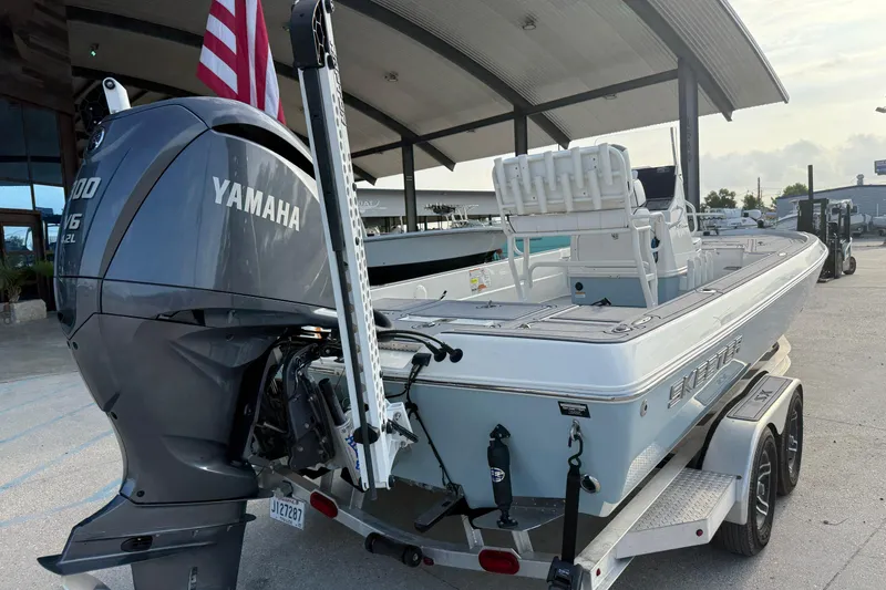 Slide: The Image of 2023 Skeeter SX240 boat with Yamaha engine on trailer, parked outdoors. - 3