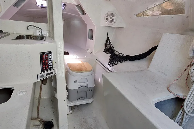 Slide: The Image of Interior view of a 2007 Farrier F-82R sailboat cabin with sunlight through a hatch. - 11