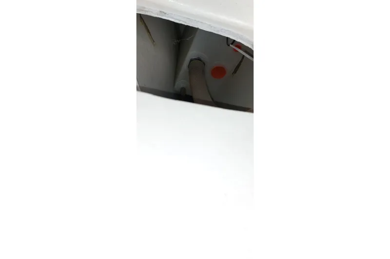 Slide: The Image of Interior of a 2007 Farrier F-82R sailboat, featuring storage compartments and safety equipment. - 13
