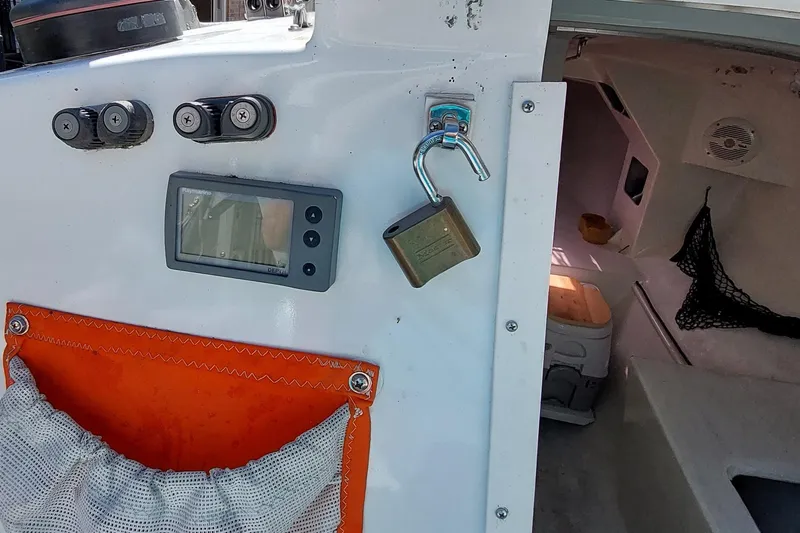 Slide: The Image of Interior of a 2007 Farrier F-82R sailboat, featuring equipment and storage compartments. - 14
