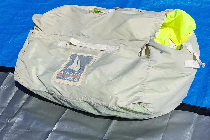 Slide: The Image of Coiled sail and ropes on blue tarp, Farrier F-82R, 2007 model. - 23