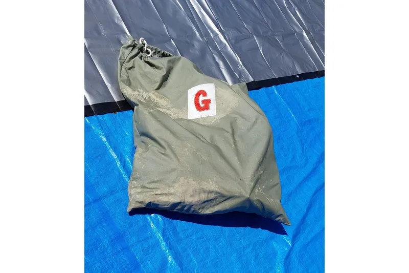 Slide: The Image of Coiled sail on blue tarp, Farrier F-82R, 2007 model. - 27