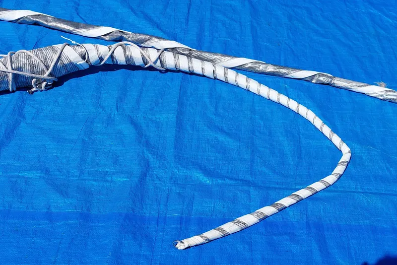 Slide: The Image of Sail laid out on pavement, likely from a 2007 Farrier F-82R model. - 30