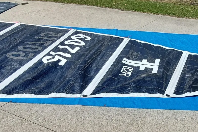 Slide: The Image of Sail from a 2007 Farrier F-82R boat, displayed on a concrete surface. - 33