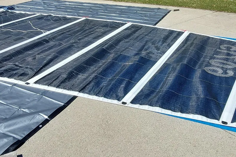 Slide: The Image of Sail of a 2007 Farrier F-82R, featuring blue and white panels on a flat surface. - 37