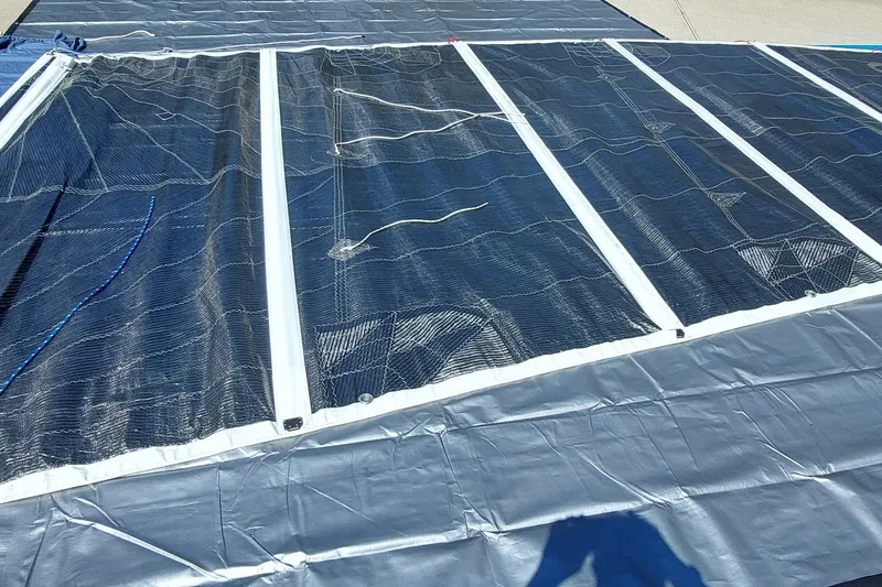 Slide: The Image of Sail of a 2007 Farrier F-82R trimaran laid out on pavement. - 39