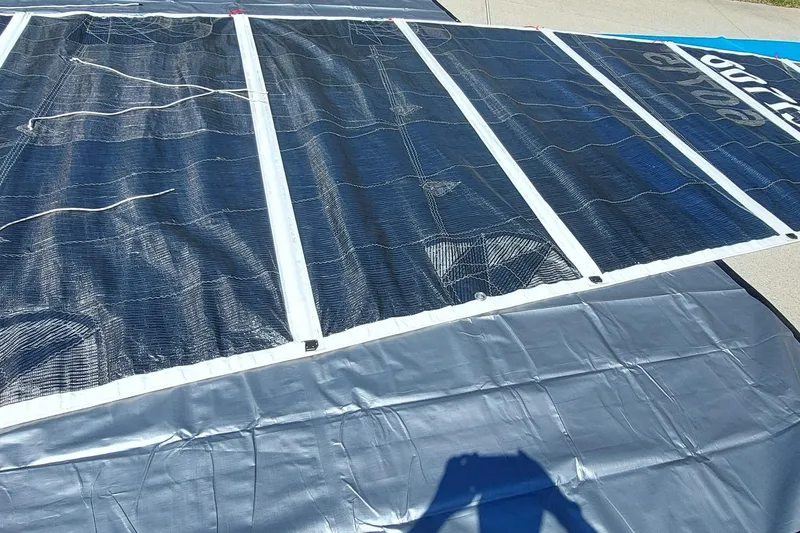 Slide: The Image of Sail laid out on ground, Farrier F-82R model, 2007, with visible rigging details. - 40