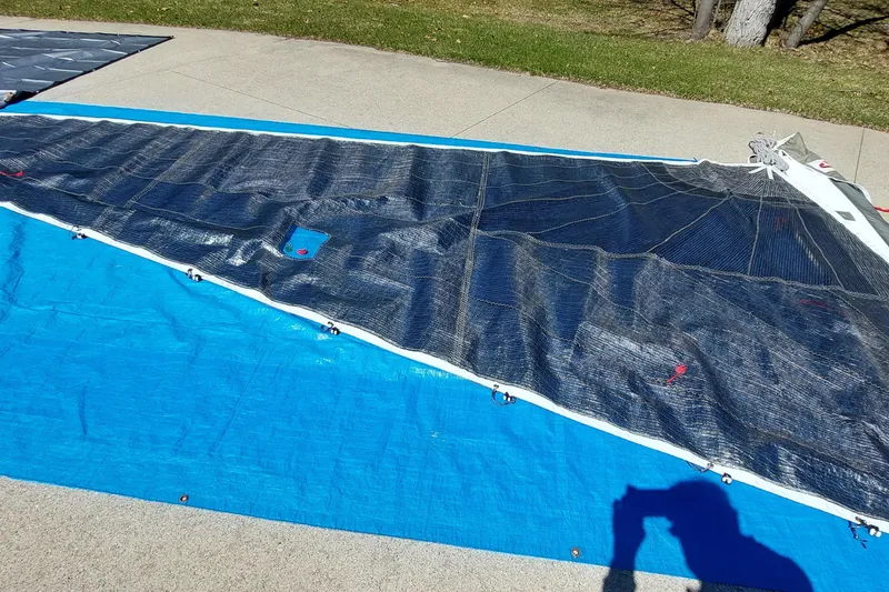 Slide: The Image of Sail laid out on blue tarp, Farrier F-82R, 2007 model, outdoors on sunny day. - 50