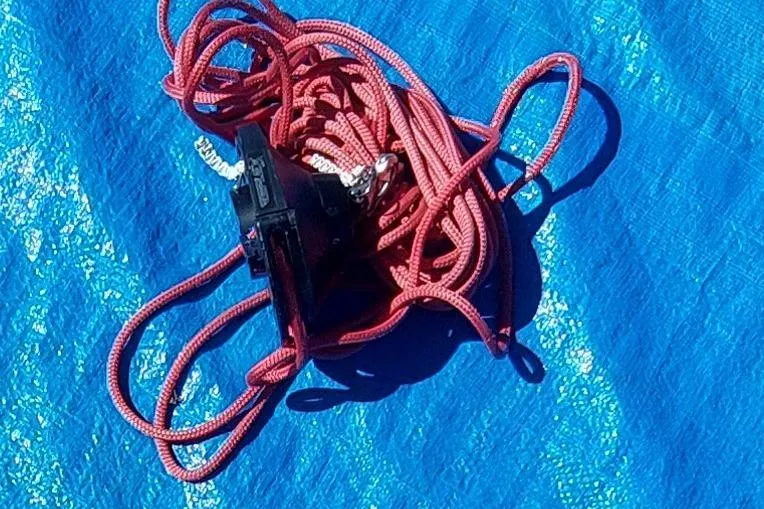 Slide: The Image of Folded blue sail with red straps on concrete floor, Farrier F-82R, 2007 model. - 52