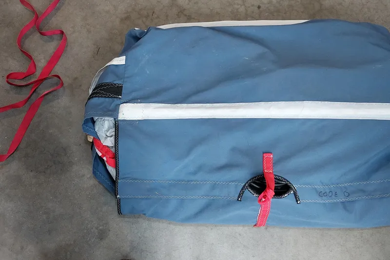 Slide: The Image of Deflated Farrier F-82R sail on blue tarp, 2007 model. - 53