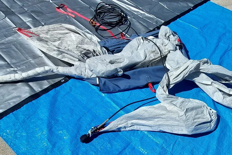 Slide: The Image of Plastic-wrapped Farrier F-82R parts on blue tarp, 2007 model. - 58