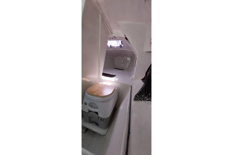 Slide: The Image of Interior of a 2007 Farrier F-82R boat with navigation equipment and storage. - 6