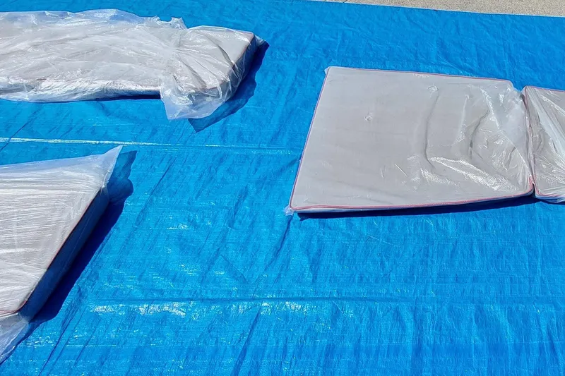 Slide: The Image of Plastic-wrapped Farrier F-82R components on blue tarp, 2007 model. - 61