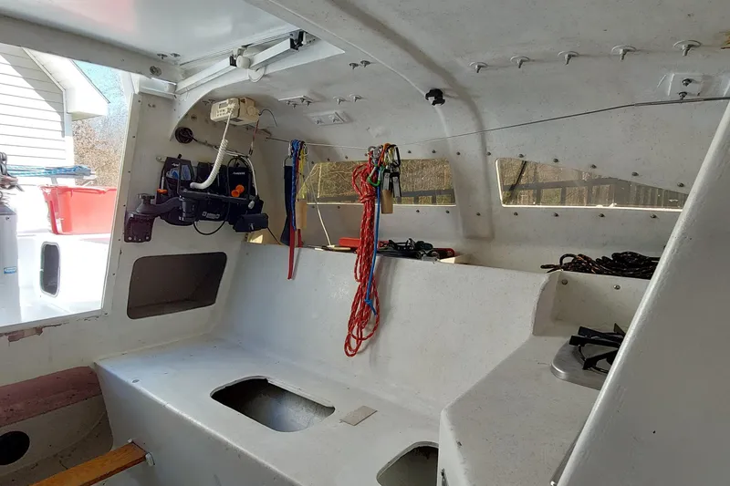 Slide: The Image of Interior of a 2007 Farrier F-82R sailboat, featuring a compact cabin and navigation equipment. - 8