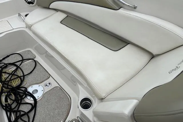 Slide: The Image of 2007 Sea Ray 260 Sundeck interior seating with beige upholstery and deck details. - 10
