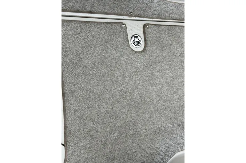 Slide: The Image of Gray carpeted interior of a 2007 Sea Ray 260 Sundeck boat. - 15