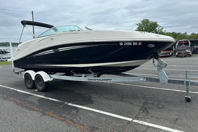Slide: The Image of 2007 Sea Ray 260 Sundeck boat on trailer in parking lot. - 21