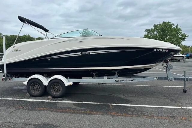 Slide: The Image of 2007 Sea Ray 260 Sundeck boat on trailer in parking lot. - 22