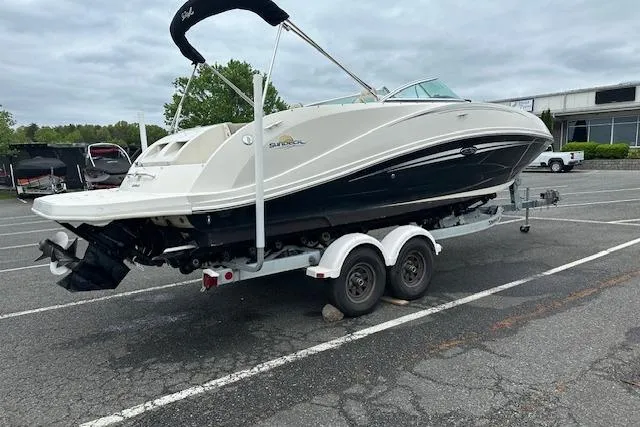 Slide: The Image of 2007 Sea Ray 260 Sundeck boat on trailer in parking lot, side view. - 23
